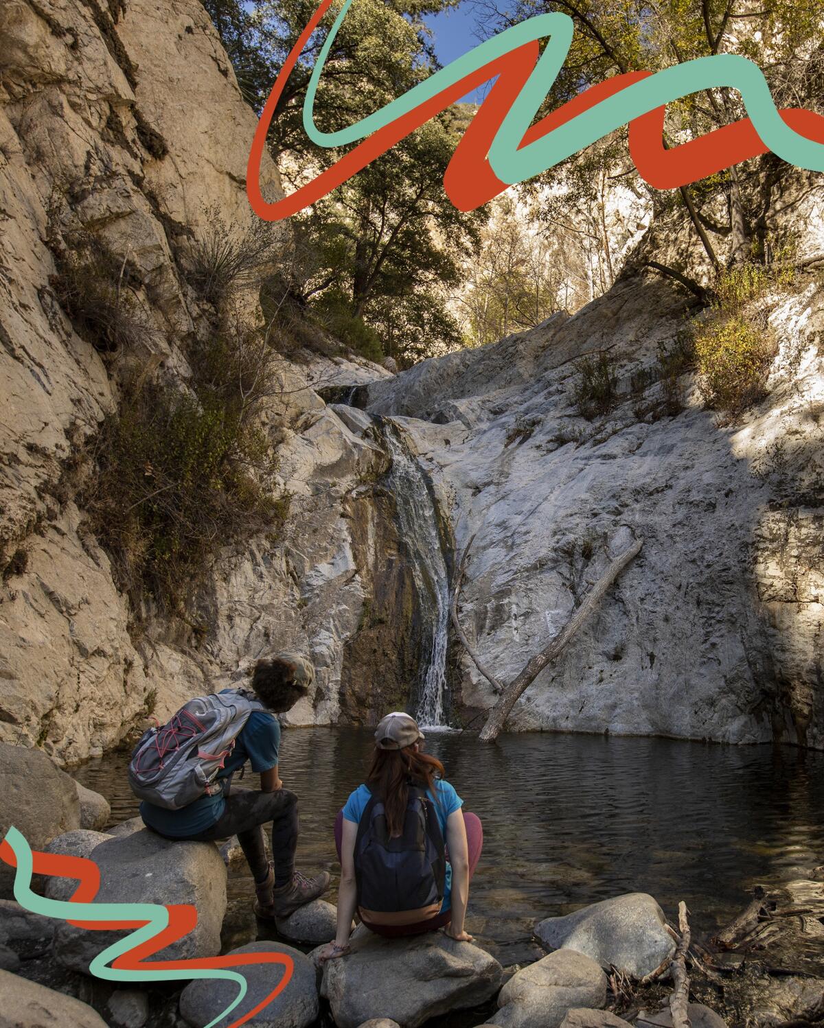 Hikers enjoy the view at lower Switzer Falls in Angeles National Forest.
