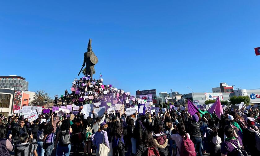 Women gathered at the Cuauhtémoc monument in Tijuana to participate in an event to commemorate International Women's Day. 
