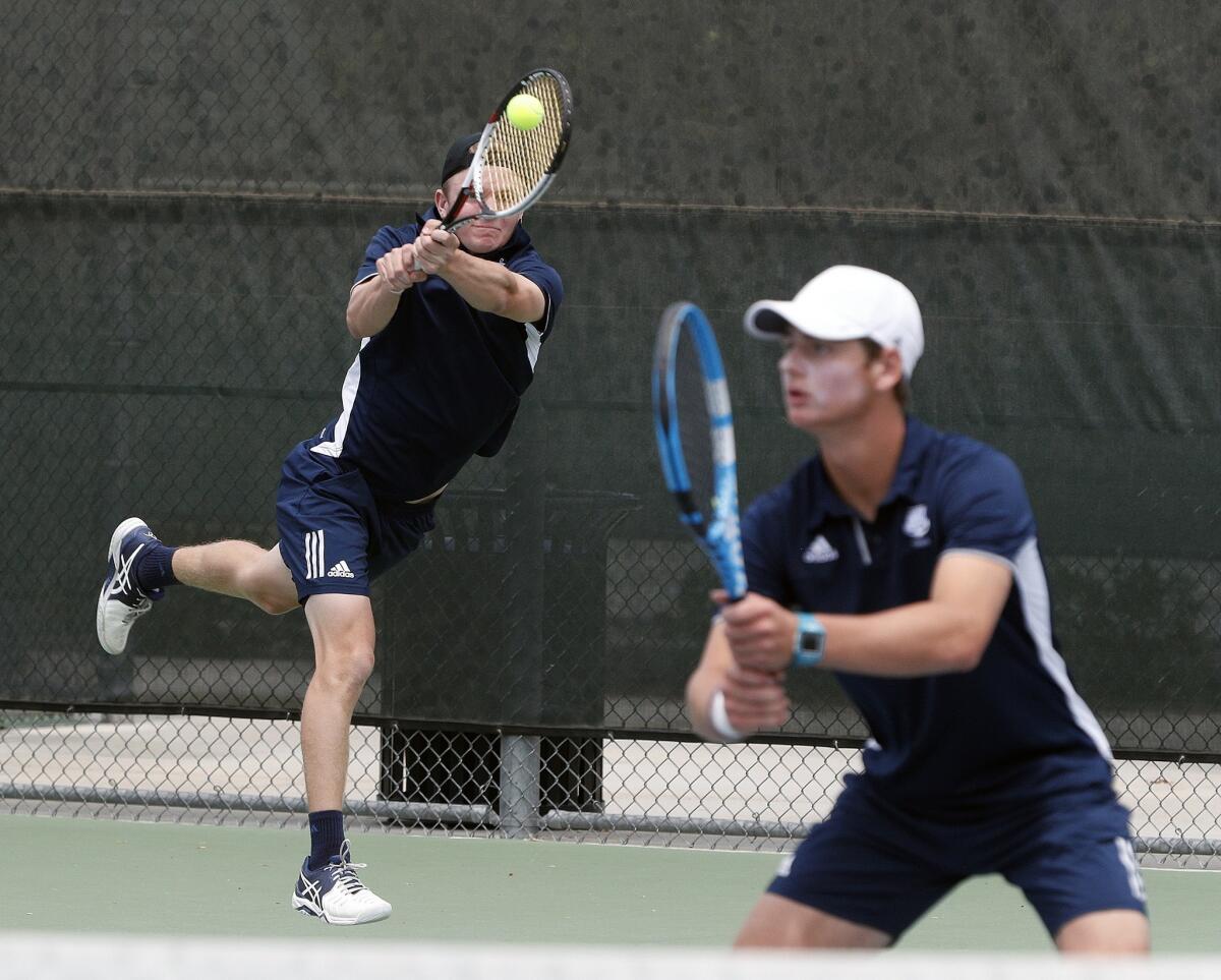 Newport Harbor's Josh Watkins gets to the ball for a forehand return in a doubles match with teammate Prescott Cook during the CIF Southern Section Individuals tournament at Andulka Park Tennis Center in Riverside on Friday.