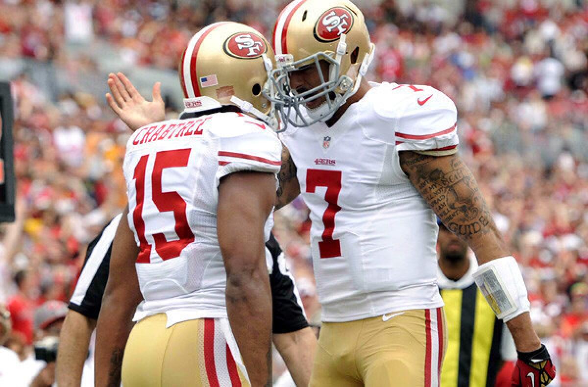 49ers quarterback Colin Kaepernick (7) celebrates with receiver Michael Crabtree (15) after they connected for a touchdown last month against Tampa Bay.
