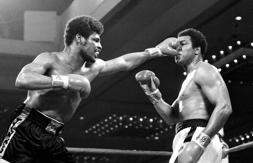 Leon Spinks flattens the nose of heavyweight champion Muhammad Ali in their 1978 title fight at Las Vegas.