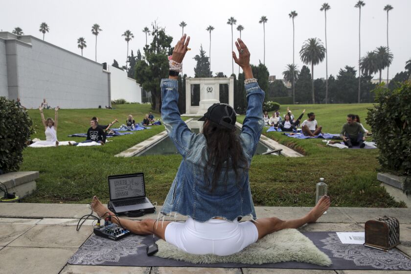 Los Angeles, CA - September 08: Monique Reymond holds a hypno-yoga class on the grounds of Cathedral Mausoleum at Hollywood Forever Cemetery on Wednesday, Sept. 8, 2021 in Los Angeles, CA. (Irfan Khan / Los Angeles Times)