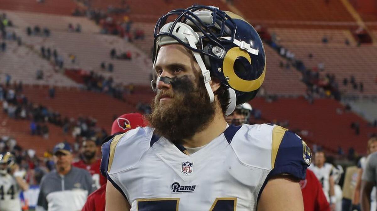 Rams linebacker Bryce Hager leaves the Coliseum field after a game.