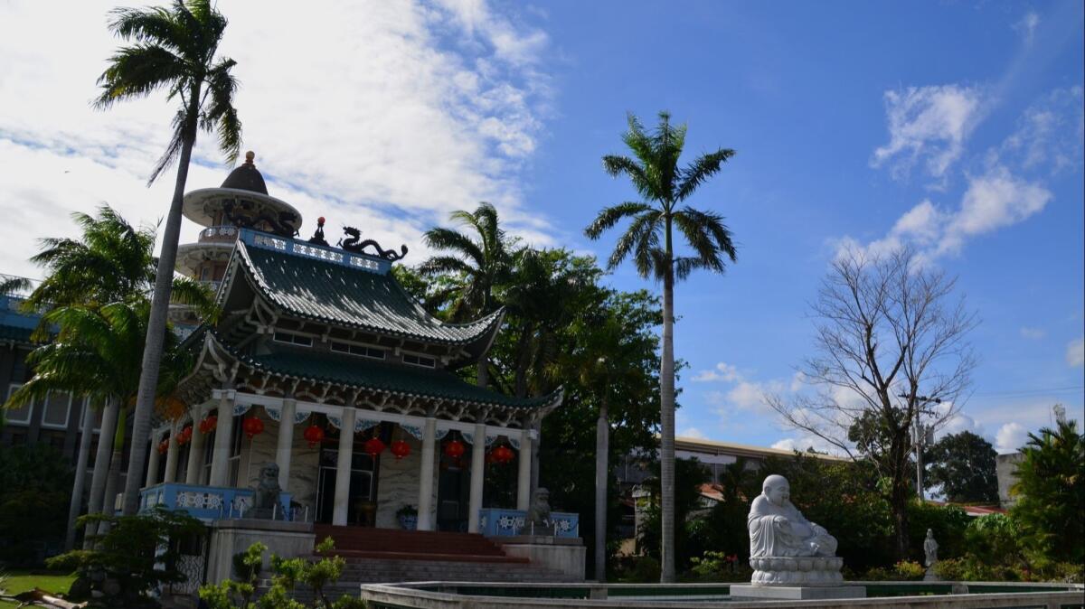 Longhua Temple, front view with smiling Buddha statue. It is one of the biggest Buddhist temples in the Philippines and the biggest in the island of Mindanao.