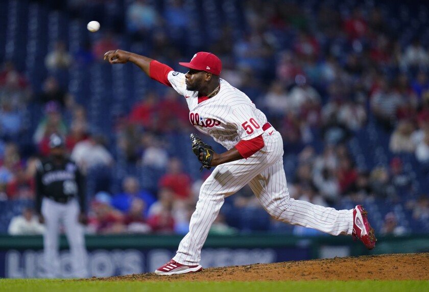 FILE - Philadelphia Phillies' Hector Neris pitches during a baseball game against the Colorado Rockies on Sept. 11, 2021, in Philadelphia. The Houston Astros signed right-hander Neris to a $17 million, two-year contract Tuesday with an option for 2024, bringing an experienced closer to the American League champions. (AP Photo/Matt Slocum, File)