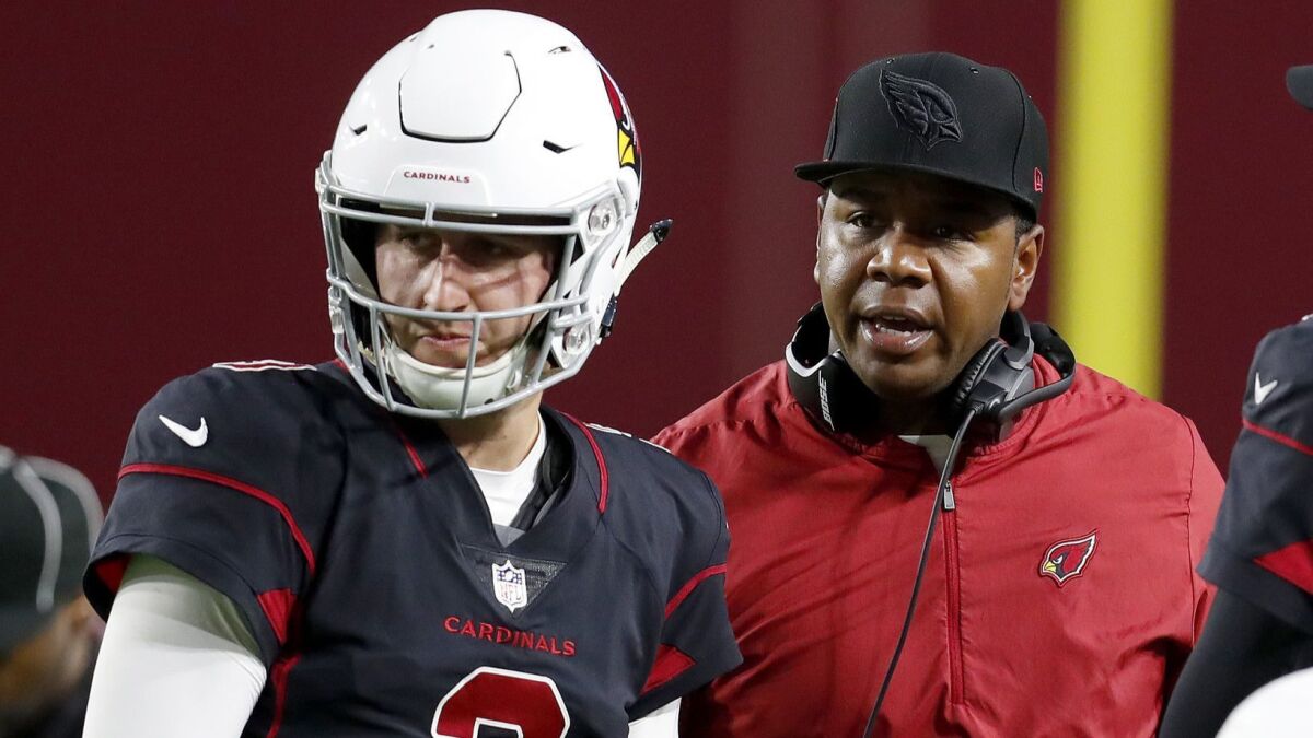 Arizona Cardinals quarterback is shown with offensive coordinator Byron Leftwich.