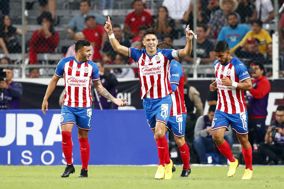 GUADALAJARA, MEXICO - MARCH 07: Jesús Molina #20 of Chivas celebrates after scoring the first goal of his team during the 9th round match between Atlas and Chivas as part of the Torneo Clausura 2020 Liga MX at Jalisco Stadium on March 7, 2020 in Guadalajara, Mexico. (Photo by Refugio Ruiz/Getty Images)
