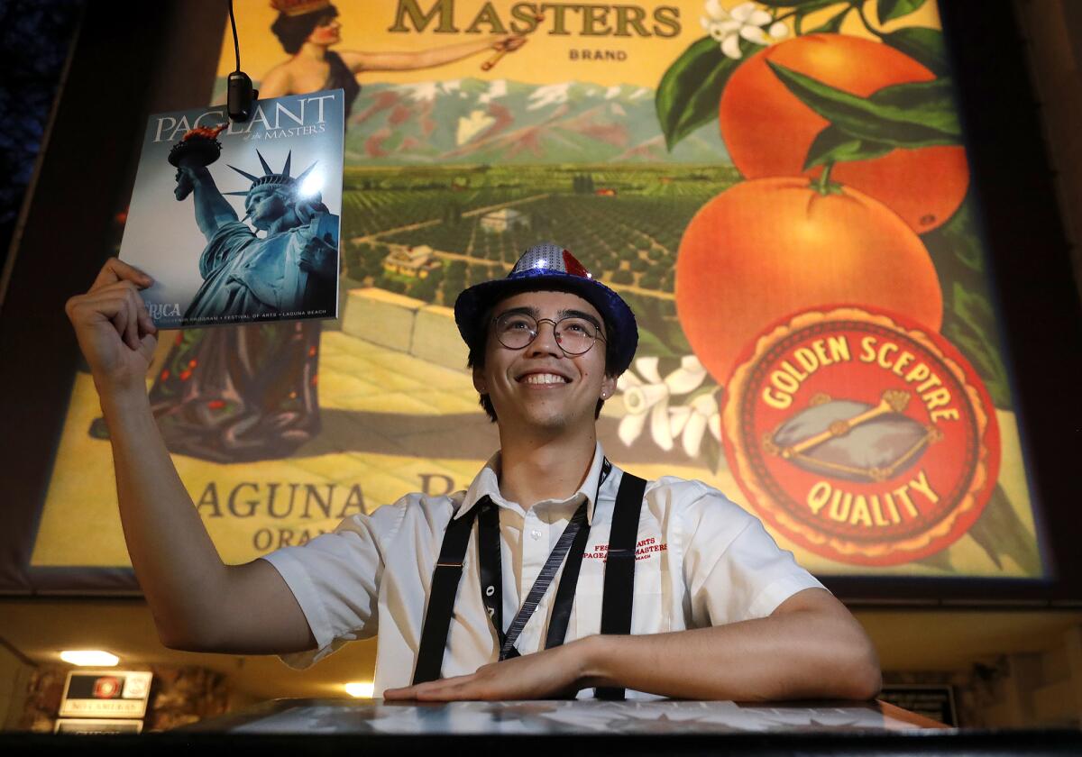 Sean Higuchi sells programs in front of the Irvine Bowl theater at the 2021 Pageant of the Masters show.