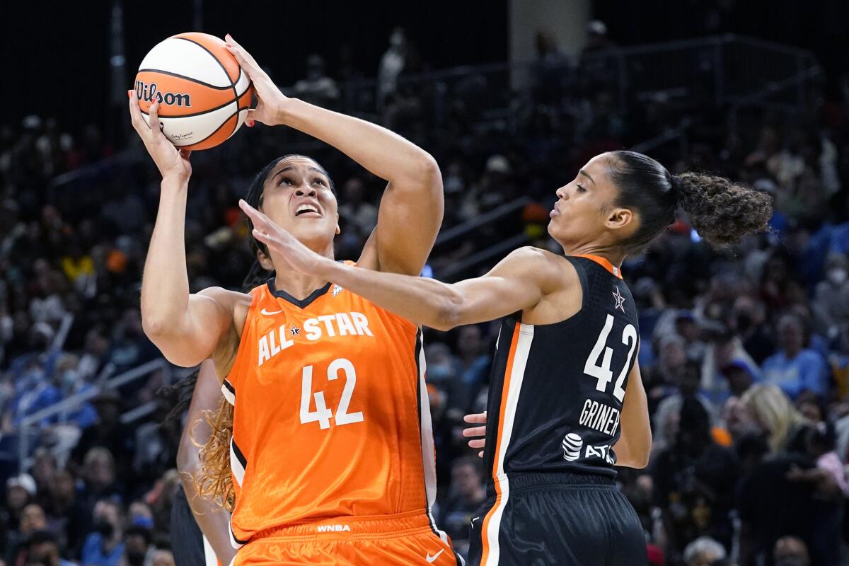 Team Wilson's Brionna Jones, left, shoots against Team Stewart's Skylar Diggins-Smith during the second half of a WNBA All-Star basketball game in Chicago, Sunday, July 10, 2022. (AP Photo/Nam Y. Huh)
