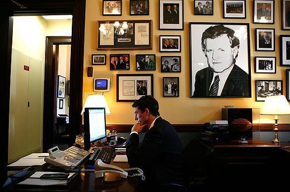 Henry Sanford, a staff assistant in the office the late Sen. Edward M. Kennedy (D-Mass.), reads the news about Kennedy's death on the Internet. Kennedy died at age 77 at his home in Hyannis Port, Mass., on Tuesday after battling brain cancer.