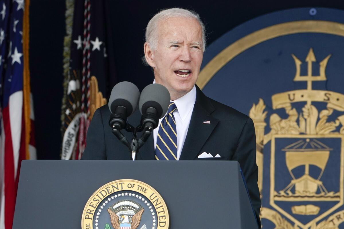 President Biden speaks at a lectern with the presidential seal on it.