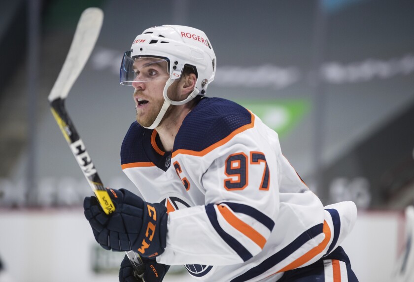 Edmonton Oilers' Connor McDavid skates against the Vancouver Canucks during the first period of an NHL hockey game, Monday, May 3, 2021, in Vancouver, British Columbia. (Darryl Dyck/The Canadian Press via AP)