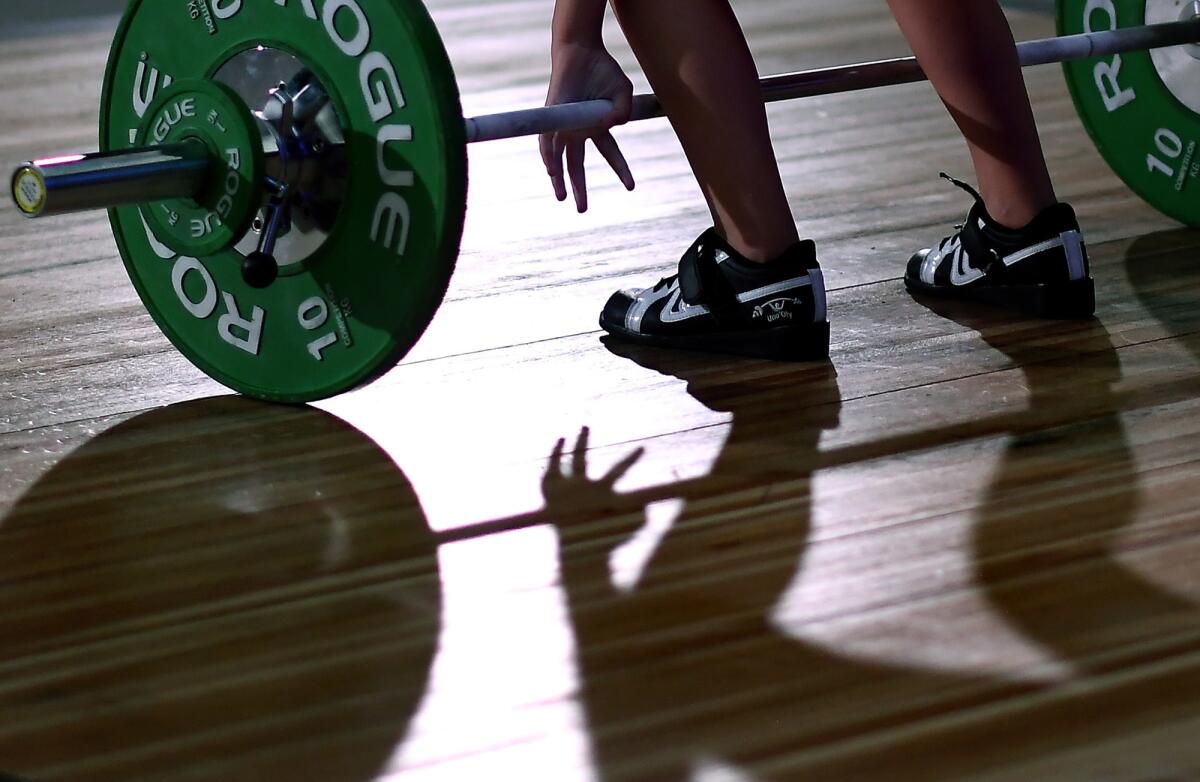 Penelope Meyers, 11, prepares to make a lift in the under 13 year-old category. (Wally Skalij / Los Angeles Times)