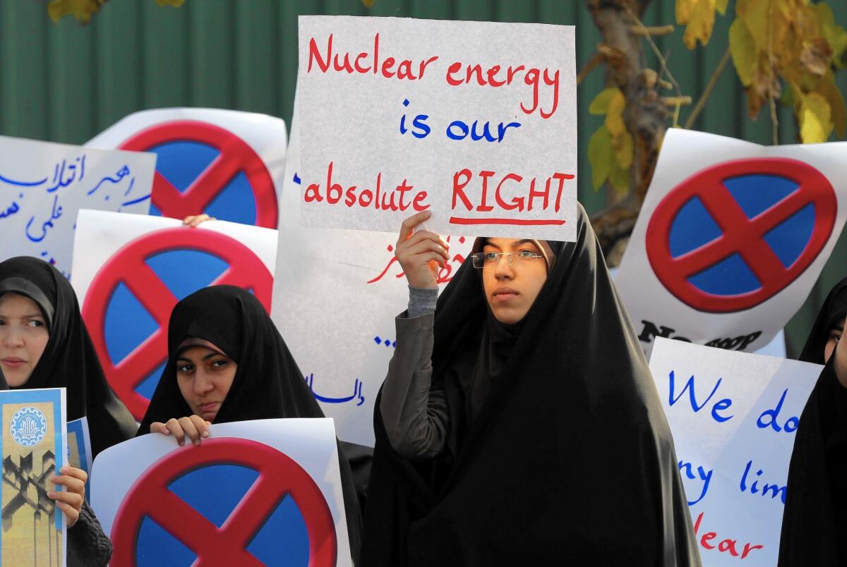 Iranian students take part in a demonstration outside the Tehran Research Reactor.