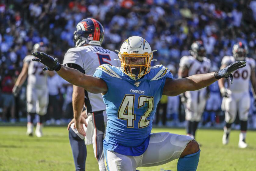 CARSON, CA, SUNDAY, OCTOBER 6, 2019 - Los Angeles Chargers linebacker Uchenna Nwosu (42) celebrates after harassing Denver Broncos quarterback Joe Flacco (5) during third quarter action at Dignity Health Sports Park. (Robert Gauthier/Los Angeles Times)