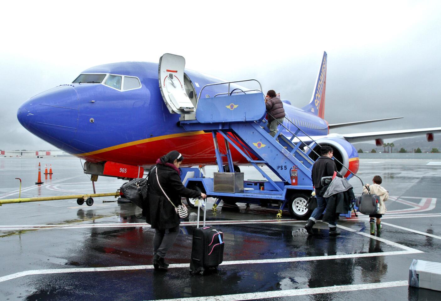 Passengers head out to the board the first Southwest Airlines Burbank-to-San Francisco flight out of the Bob Hope Airport, in Burbank on Wednesday, January 6, 2016. The airport already served SFO but with a different airline.