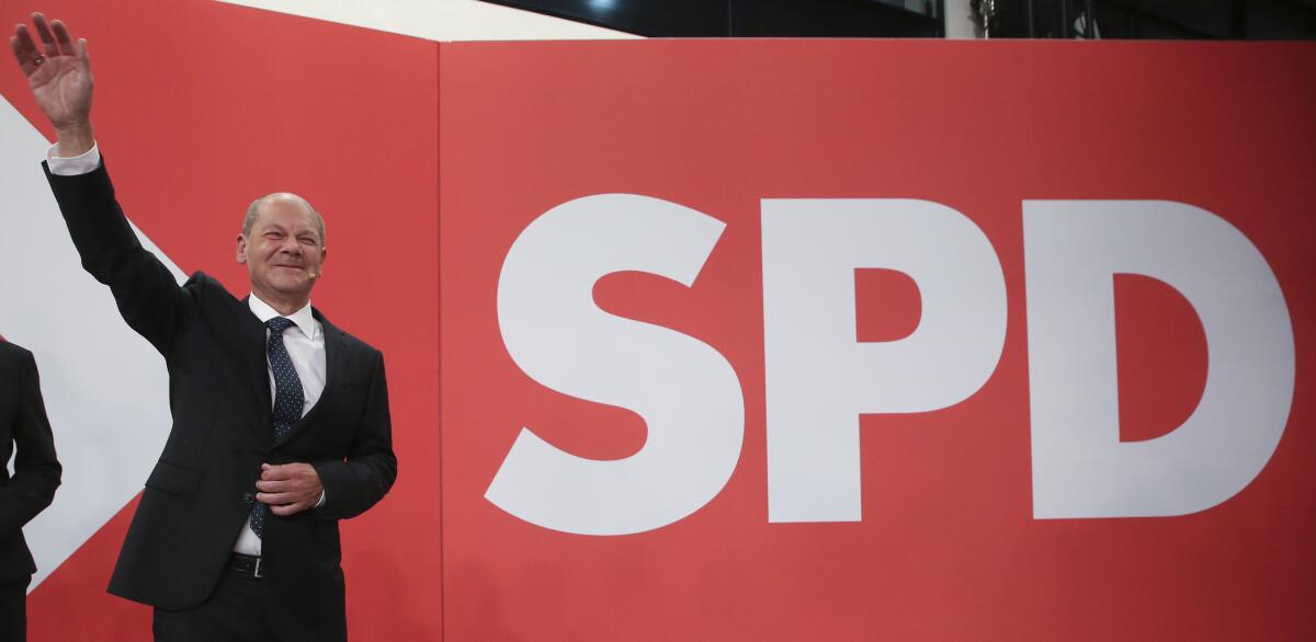 Olaf Scholz, Finance Minister and SPD candidate for Chancellor, waves during the election party at Willy Brandt House