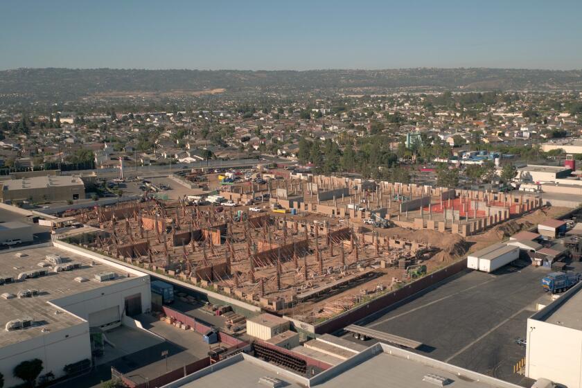 Aerial view of construction of Sea Breeze, a 352-unit apartment project in the Harbor Gateway area. The project is being built in an area zoned for industrial rather than residential use.