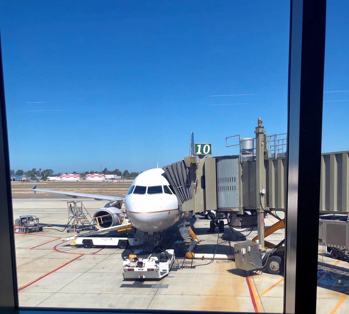United Airlines prepares to board a full flight from John Wayne Airport to Denver on a recent weekday.