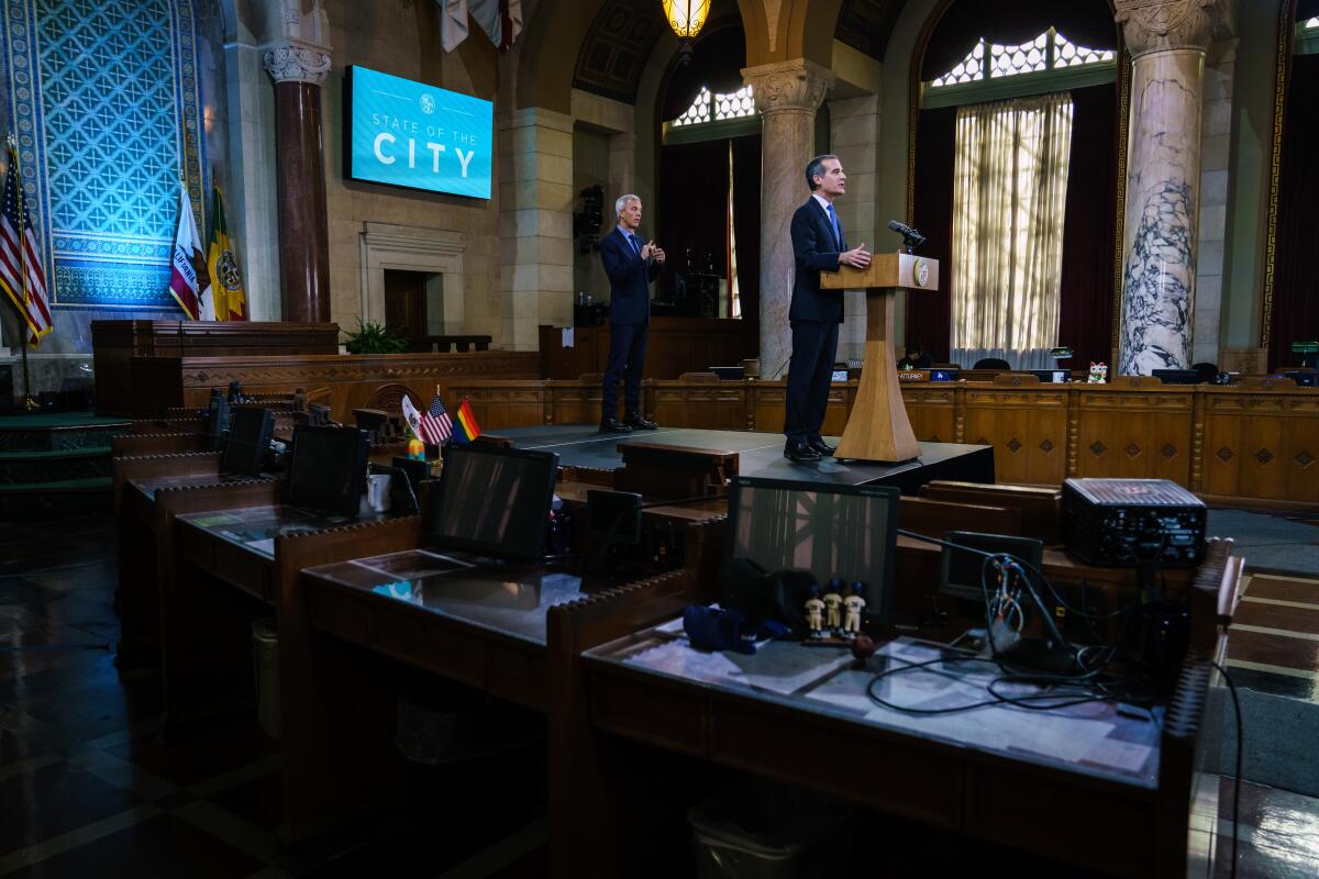 Los Angeles Mayor Eric Garcetti, delivering his State of the City speech in a nearly empty City Council chamber