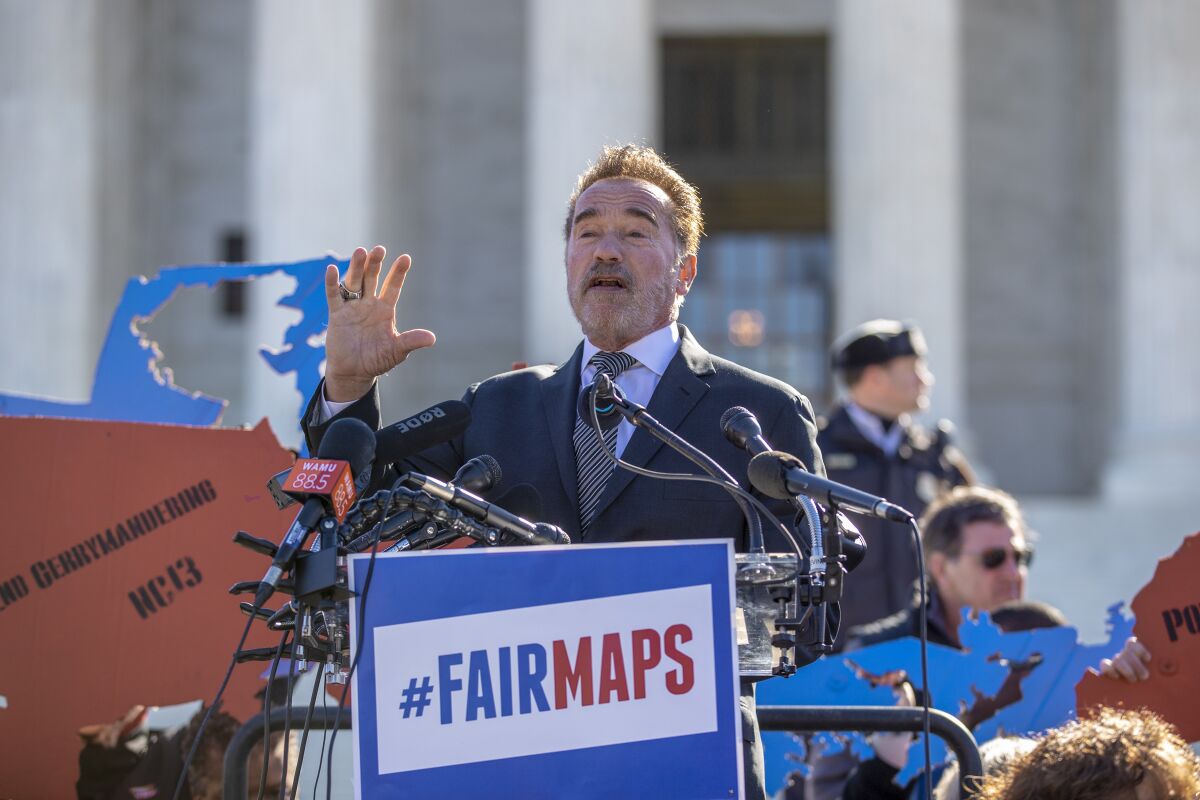FILE - In this March 26, 2019, file photo former California Gov. Arnold Schwarzenegger speaks at a rally calling for "Fair Maps" at the Supreme Court in Washington. In California its last Republican governor, Arnold Schwarzenegger, passed a 2008 ballot measure creating a nonpartisan commission. (AP Photo/Carolyn Kaster, File)