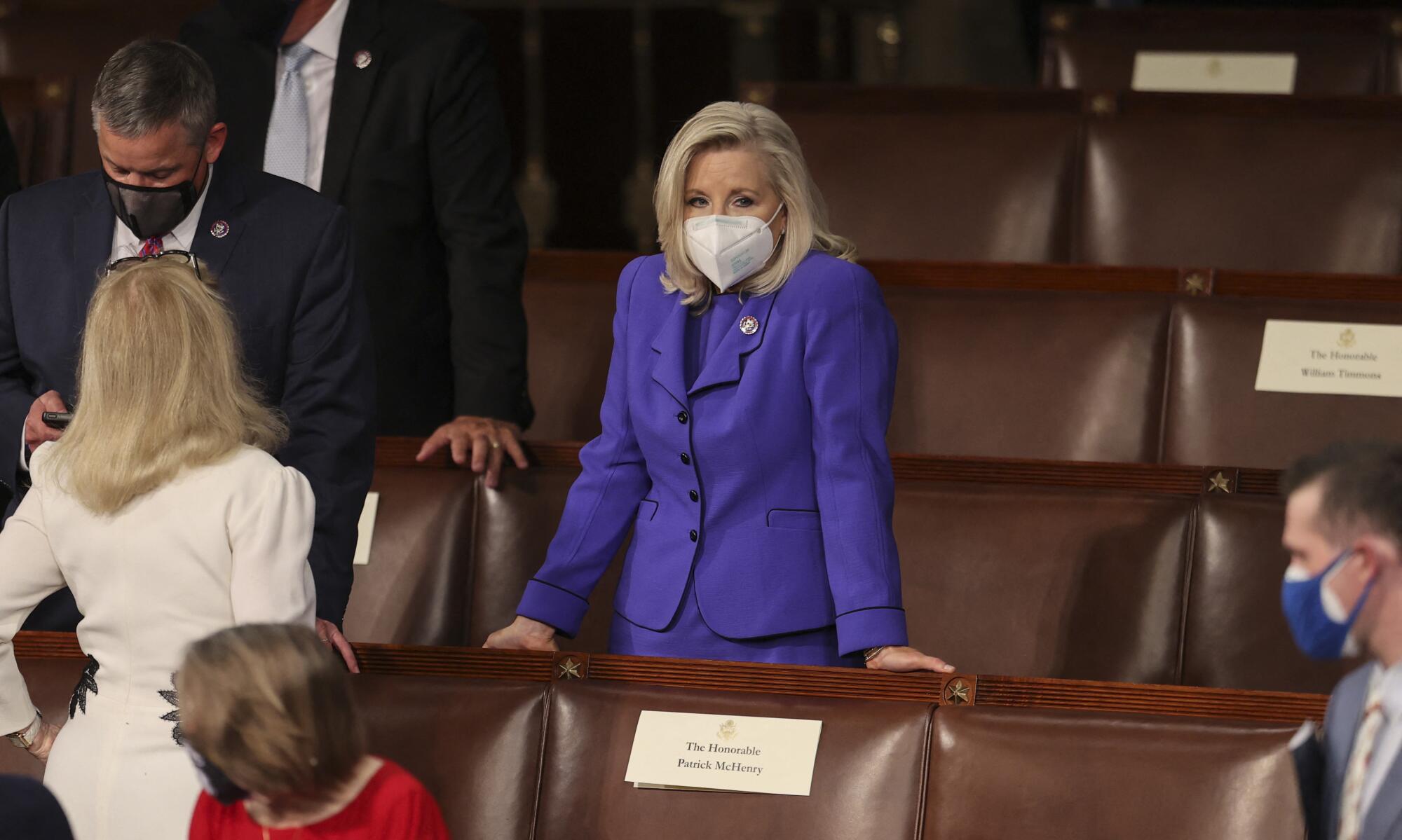 Rep. Liz Cheney (R-Wyo.) waits for President Joe Biden to deliver his first address to a joint session of Congress.