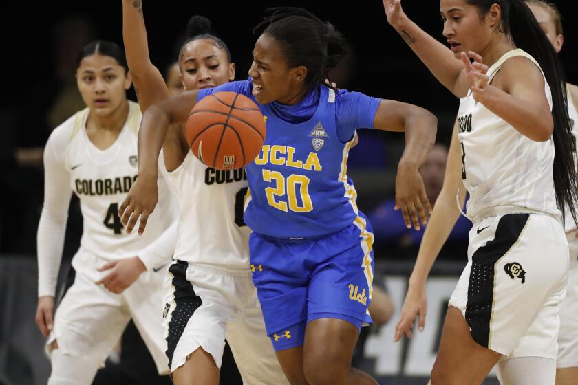 UCLA guard Charisma Osborne (20) in the first half of an NCAA college basketball game Sunday, Jan. 12, 2020, in Boulder, Colo. (AP Photo/David Zalubowski)