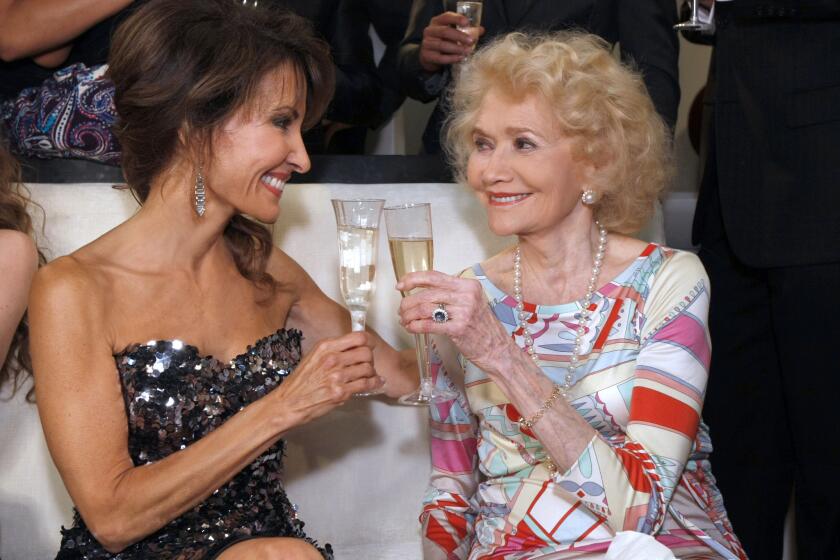 Susan Lucci and Agnes Nixon appear in this file photo celebrating the final episode of ABC Daytime's "All My Children" taped on Aug. 30, 2011. Nixon, creator of "All My Children" and other soap operas died Wednesday at age 93.
