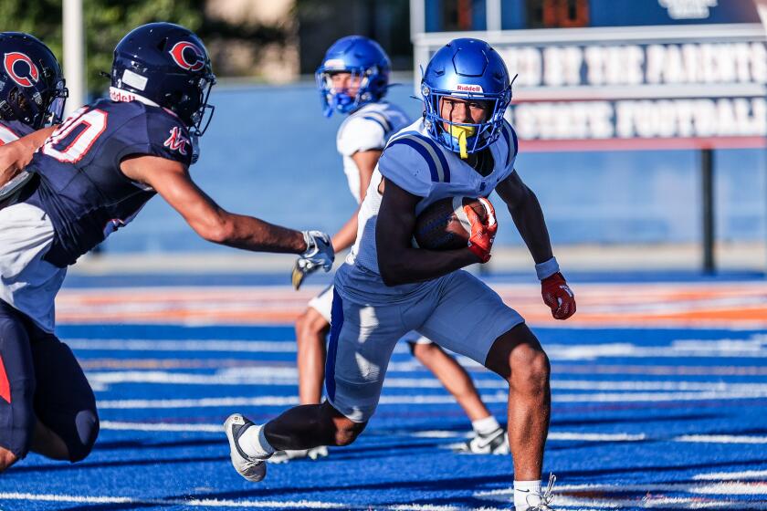 Trent Mosley of Santa Margarita makes catch during scrimmage Thursday against Chaminade.