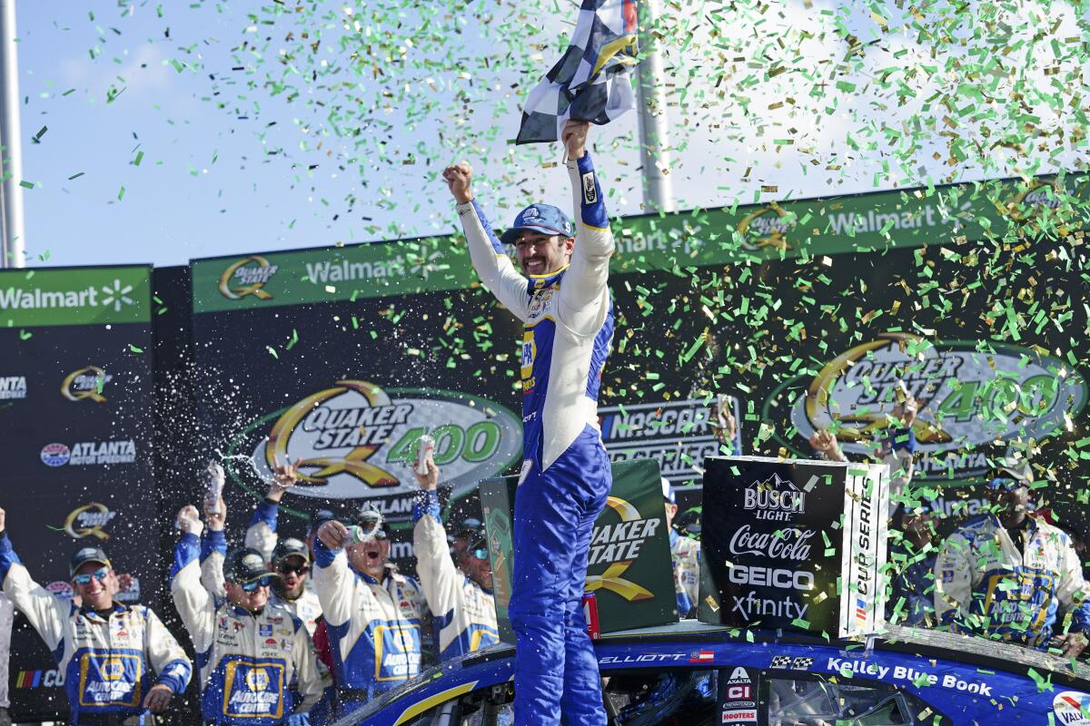 Chase Elliott reacts in Victory Lane after winning the NASCAR Cup Series at Atlanta Motor Speedway.