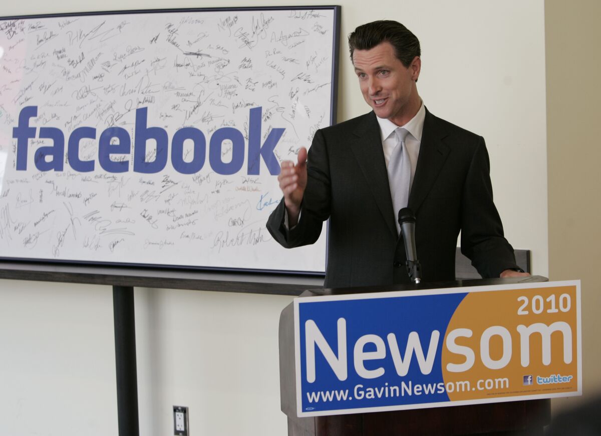 FILE - Then San Francisco Mayor Gavin Newsom formally announces his candidacy for California governor at Facebook headquarters in Palo Alto, Calif., Tuesday, April 21, 2009. Newsom solicited donations totaling nearly $227 million from Facebook, Google, Blue Shield and other private California companies and organizations to combat the pandemic and help run parts of his administration. The report Thursday, Jan. 13, 2022 by the state’s political watchdog agency examines contributions solicited by an elected official to be given to another individual or organization. (AP Photo/Paul Sakuma, File)