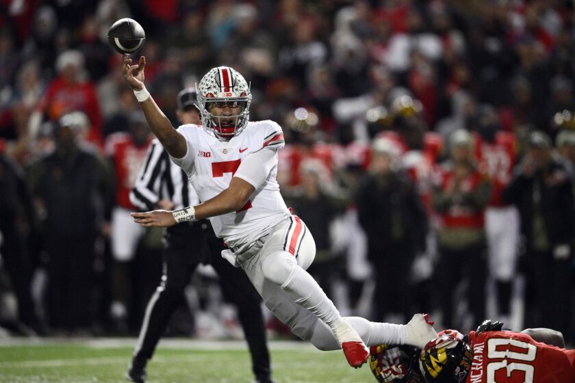 Ohio State quarterback C.J. Stroud (7) throws the ball away during the second half of an NCAA college football game against Maryland, Saturday, Nov. 19, 2022, in College Park, Md. Ohio State won 43-30. (AP Photo/Nick Wass)
