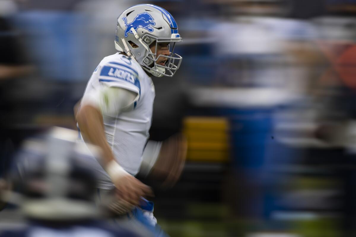 Matthew Stafford runs during a game between the Lions and Tennessee Titans last season.