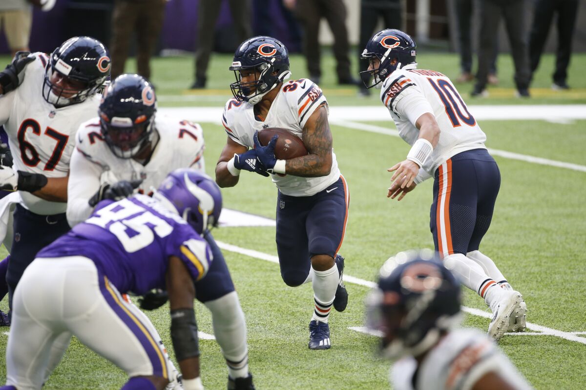 Chicago Bears running back David Montgomery carries the ball against the Minnesota Vikings.