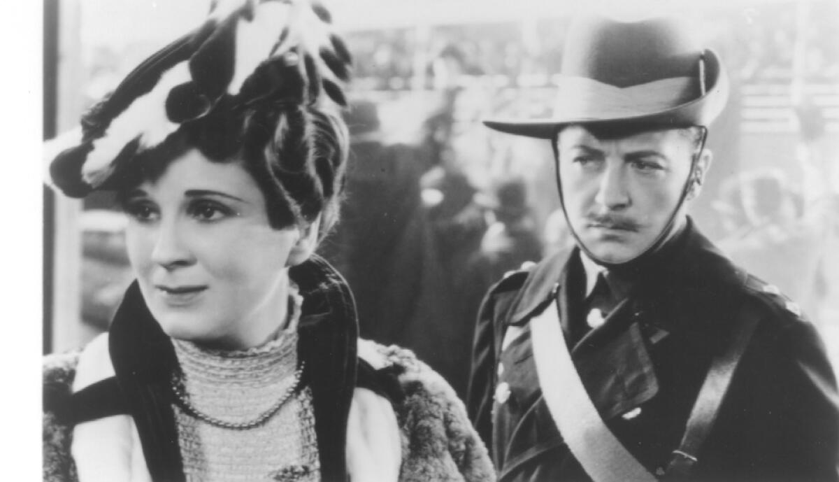 Diana Wynward and Clive Brook, in a military uniform, in "Cavalcade" (1933)