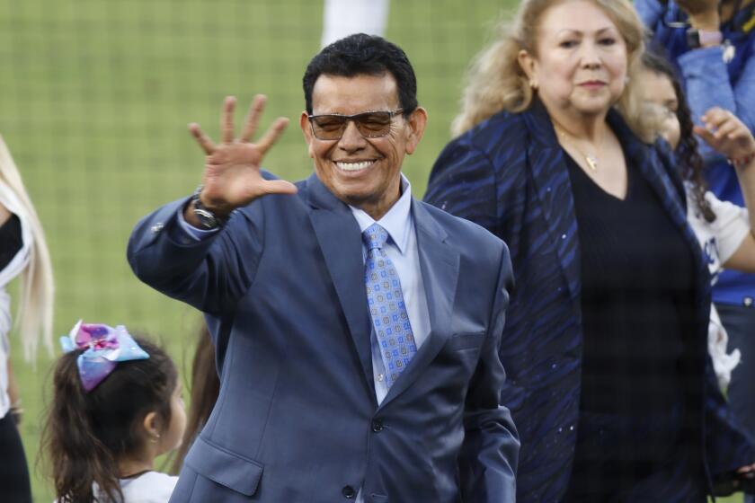 LOS ANGELES, CA - AUGUST 11: Sounded by family Fernando Valenzuela waves to the fans.