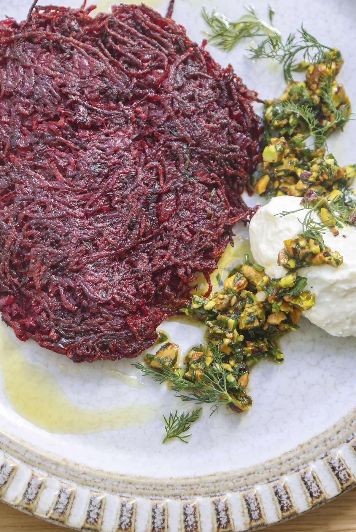 Red beet latkes with whipped feta and pistachio gremolata
