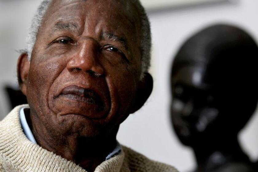 Chinua Achebe posed in 2008 at his home on the campus of Bard College in New York.