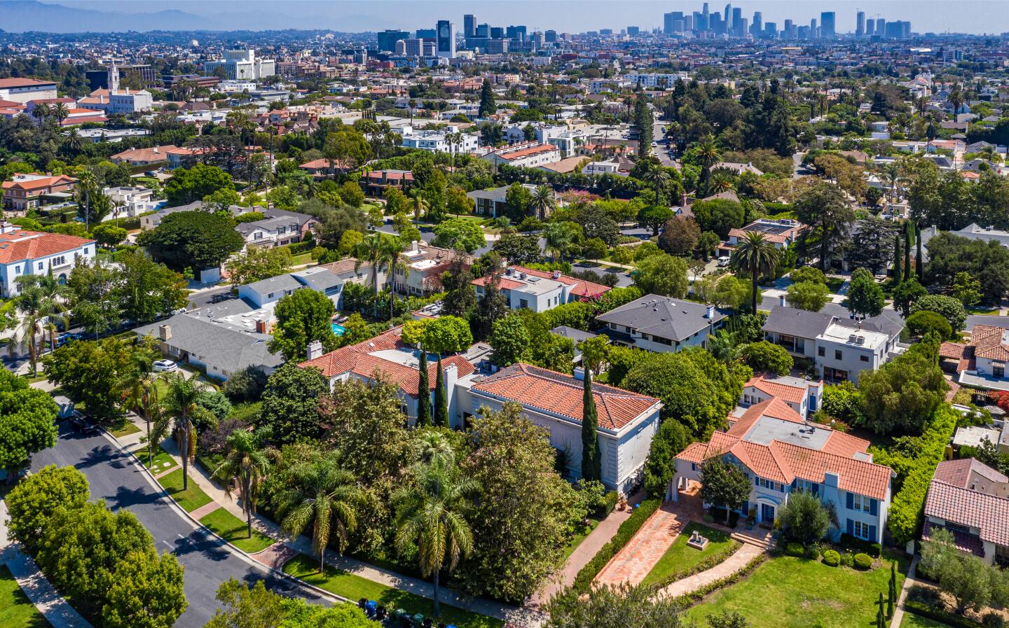 Aerial view of the home among other homes.