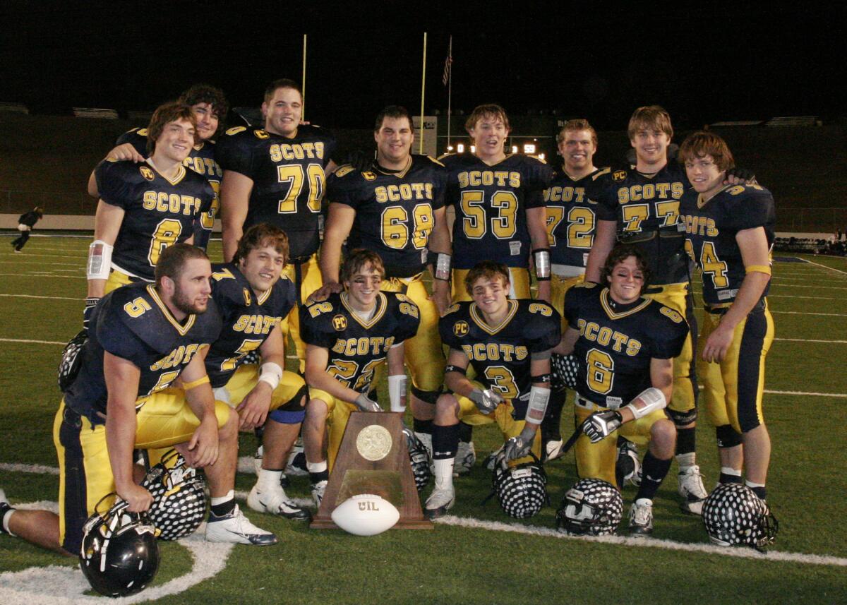 Matthew Stafford and his Highland Park Scots offense and running backs pose with the state trophy.
