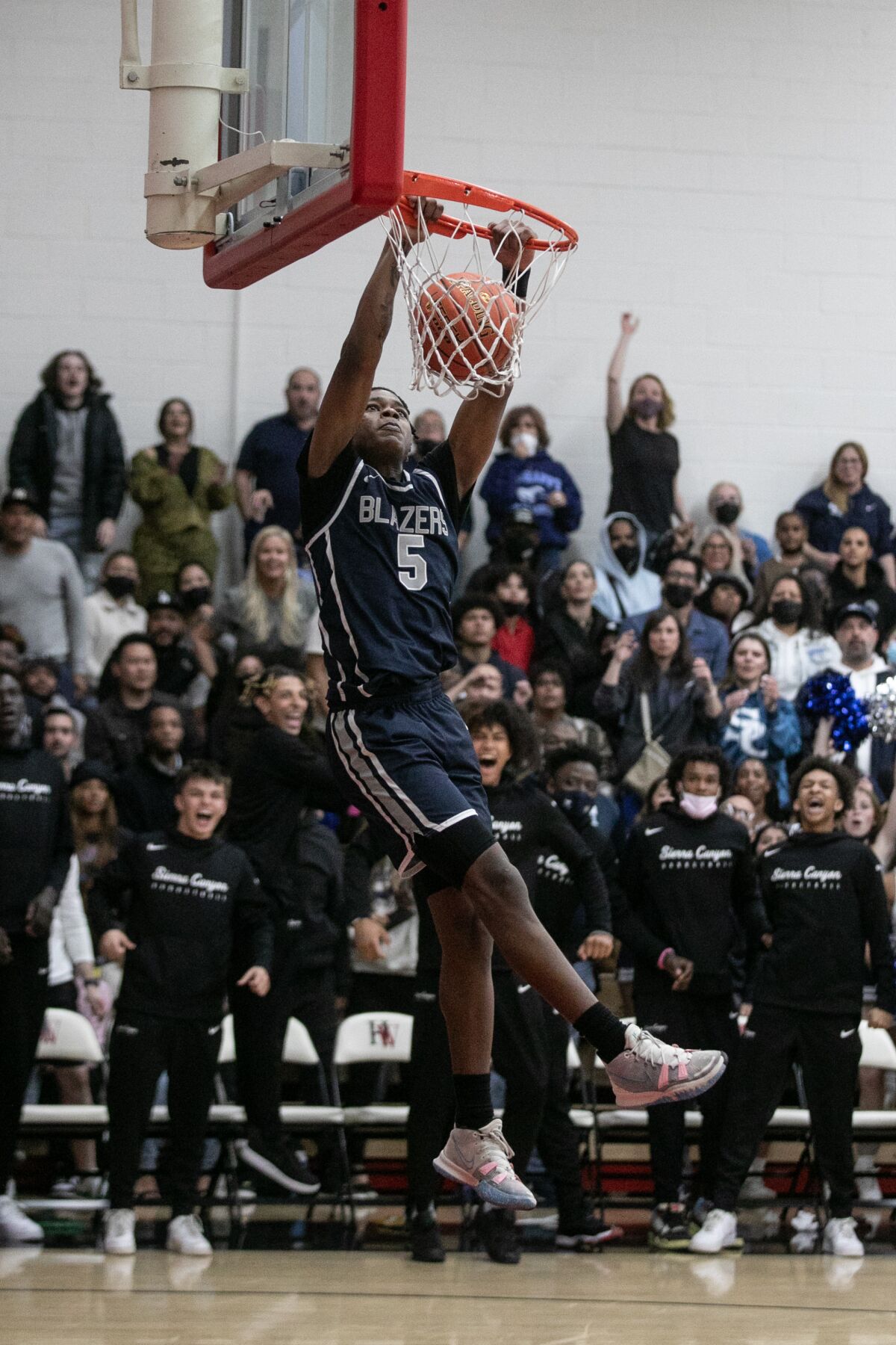Sierra Canyon's Mike Price, who had 15 points, dunks against Harvard-Westlake.