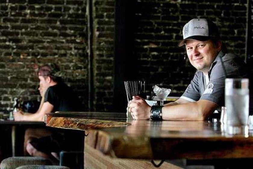 Ryan Ballinger, co-owner with Gabriel Byer of the York in Highland Park, has a seat at the bar, an L-shaped hunk of polished South American hardwood. The gastropub lists its food and drink menu on blackboards on the exposed-brick side walls.