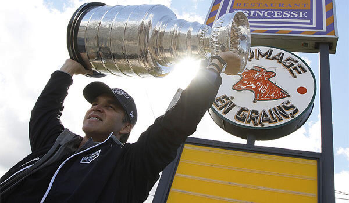 Luc Robitaille raises the Stanley Cup after the Kings' 2012 championship season.
