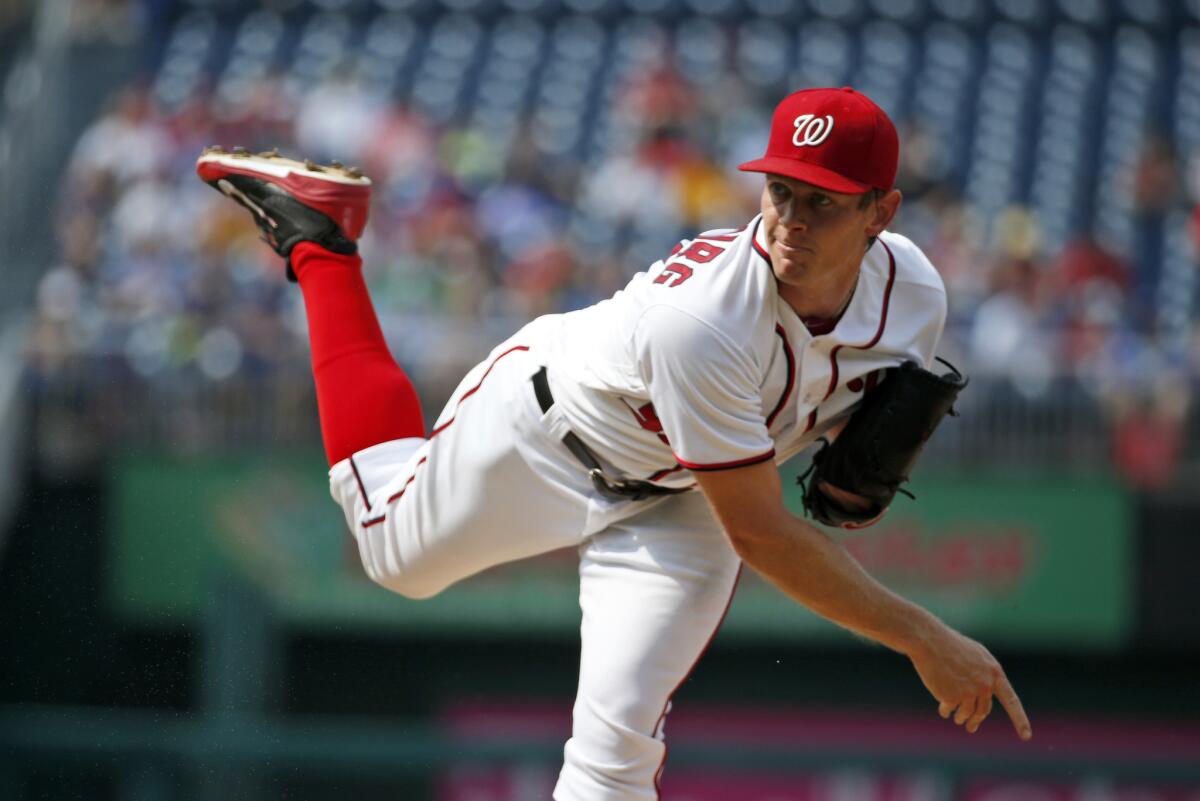 Nationals starting pitcher Stephen Strasburg throws during the first inning of a game against the Cubs on June 15.
