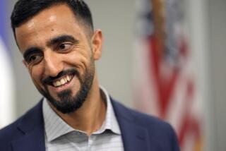 Abdul Wasi Safi smiles after a news conference Friday, Jan. 27, 2023, in Houston. Wasi Safi, an intelligence officer for the Afghan National Security Forces who fled Afghanistan following the withdrawal of U.S. forces, was freed this week and reunited with his brother after spending months in immigration detention. (AP Photo/David J. Phillip)