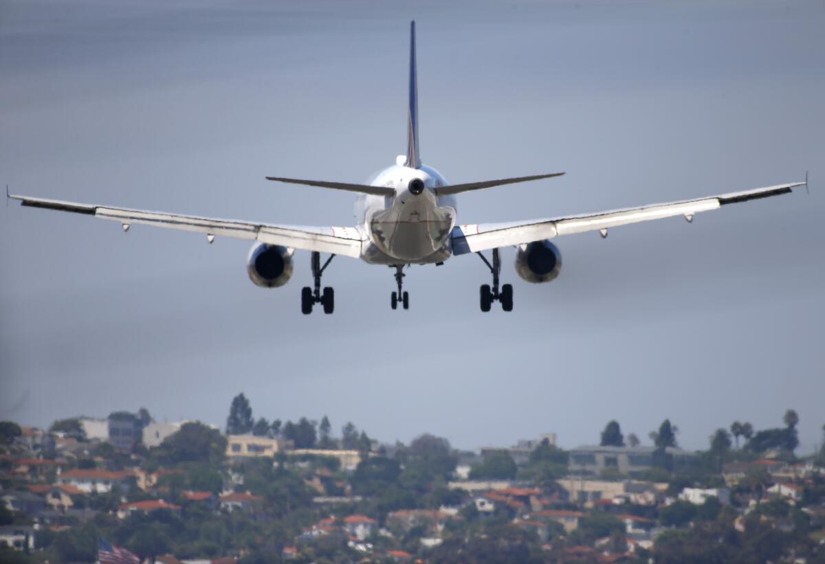 A United Airlines jet approaches San Diego International Airport.