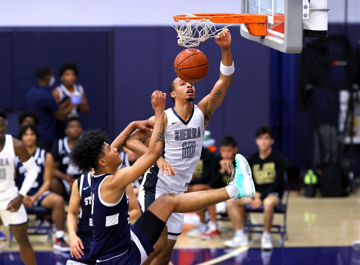 Sierra Canyon's Amariz Bailey goes up for a dunk during a playoff game against St. John Bosco in May.