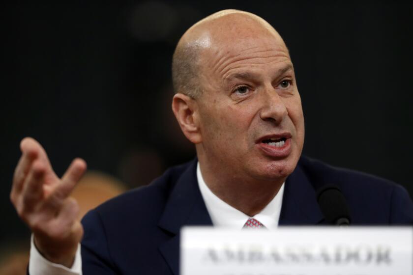 U.S. Ambassador to the European Union Gordon Sondland gives his opening statement as he testifies before the House Intelligence Committee on Capitol Hill in Washington, Wednesday, Nov. 20, 2019, during a public impeachment hearing of President Donald Trump's efforts to tie U.S. aid for Ukraine to investigations of his political opponents. (AP Photo/Andrew Harnik)