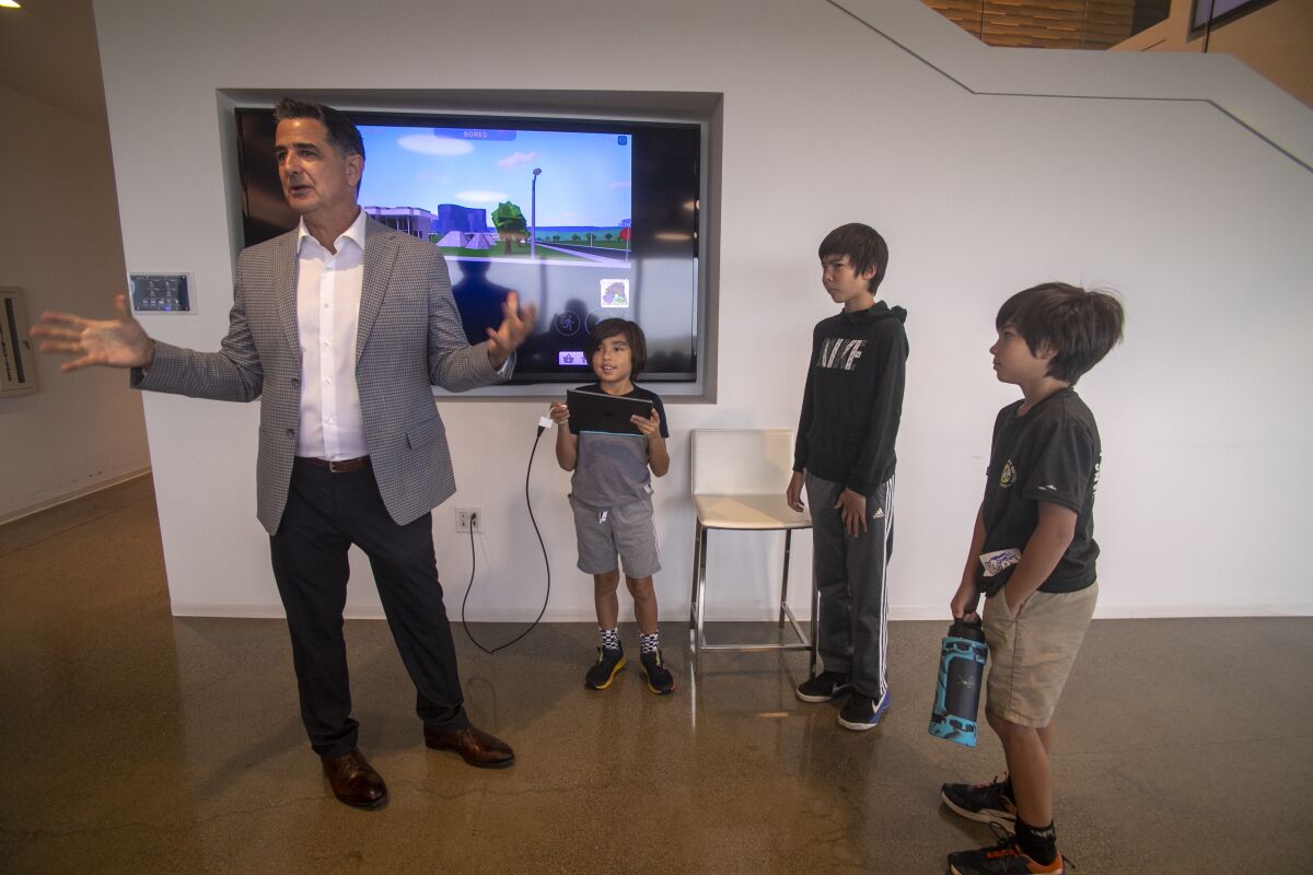 Jeff Montejano, CEO of the Building Industry Assn. of Southern California, with Joseph Jimenez and Caleb and Maddox Tam.