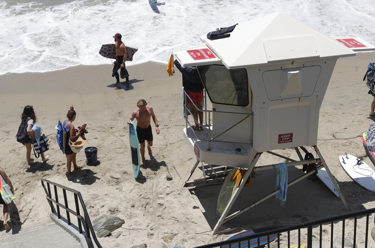 A lifeguard mans a tower at Thalia Street in Laguna Beach on Thursday.